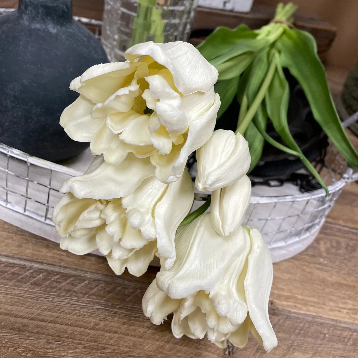 White flowers on a wooden surface with a blurred background